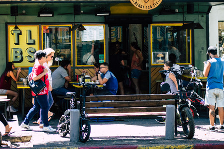 Tel Aviv Israel August 12, 2019 View of unknowns Israeli people eating at a cafe terrace in the...