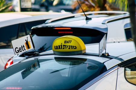 Tel Aviv Israel August 16, 2019 View of traditional Israeli taxi rolling in the streets of Tel Aviv in the afternoonのeditorial素材