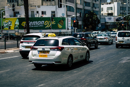 Tel Aviv Israel August 16, 2019 View of traditional Israeli taxi rolling in the streets of Tel Aviv in the afternoonのeditorial素材