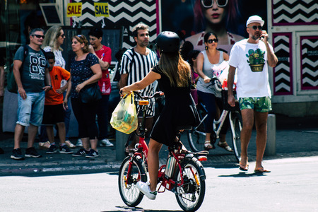 Tel Aviv Israel August 17, 2019 View of unknown people rolling with a bicycle in the streets of Tel Aviv in the afternoonのeditorial素材