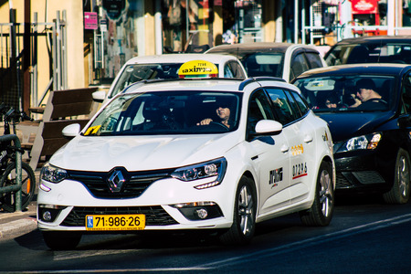 Tel Aviv Israel August 20, 2019 View of traditional Israeli taxi rolling in the streets of Tel Aviv in the afternoonのeditorial素材