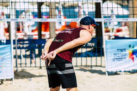 Tel Aviv Israel August 24, 2019 View of unknown Israeli people playing beach volley on the public beach of Tel Aviv in the morningの写真素材