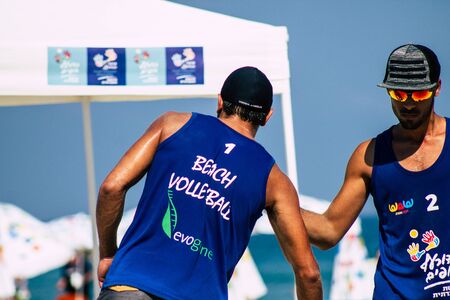 Tel Aviv Israel August 24, 2019 View of unknown Israeli people playing beach volley on the public beach of Tel Aviv in the morningの写真素材