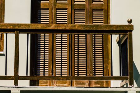 Closeup of a balcony on a facade of a house in the Plaka neighborhood in the afternoonの写真素材