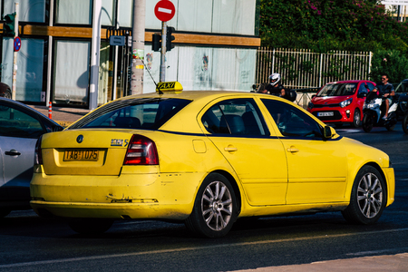 Athens Greece September 7, 2019 View of Greek yellow taxi driving through the streets of Athens in the morningのeditorial素材