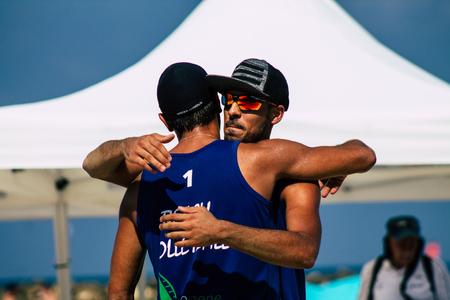 Tel Aviv Israel August 24, 2019 View of unknown Israeli people playing beach volley on the public beach of Tel Aviv in the morningのeditorial素材