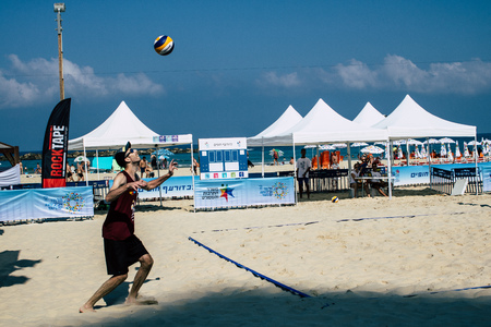 Tel Aviv Israel August 24, 2019 View of unknown Israeli people playing beach volleyball on the public beach of Tel Aviv in the morningのeditorial素材