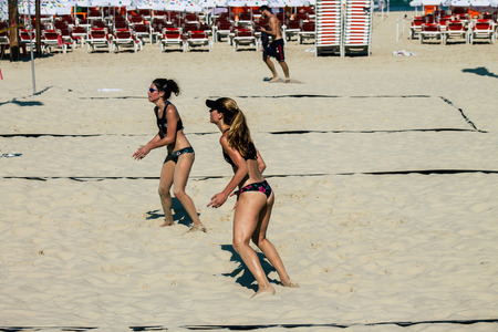 Tel Aviv Israel August 24, 2019 View of unknown Israeli girls playing beach volleyball on the public beach of Tel Aviv in the morningのeditorial素材