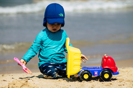 Tel Aviv Israel August 26, 2019 View of unknown Israeli kid having fun on the beach of Tel Aviv during a sunny day in the afternoonのeditorial素材