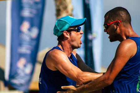 Tel Aviv Israel August 24, 2019 View of unknown Israeli people playing beach volley on the public beach of Tel Aviv in the morningのeditorial素材
