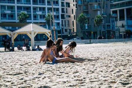 Tel Aviv Israel September 19, 2019 View of unknown Israeli people having fun on the beach of Tel Aviv during a sunny day in the afternoonの写真素材