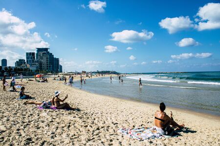Tel Aviv Israel September 19, 2019 View of unknown Israeli people having fun on the beach of Tel Aviv during a sunny day in the afternoonの写真素材