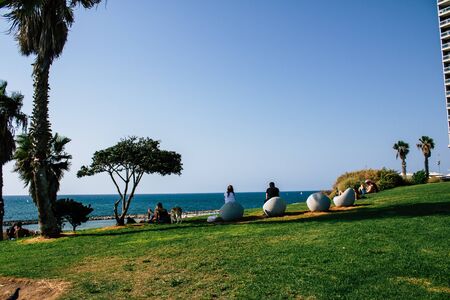 Tel Aviv Israel September 19, 2019 View of unknown Israeli people having fun in a public garden of Tel Avivの写真素材