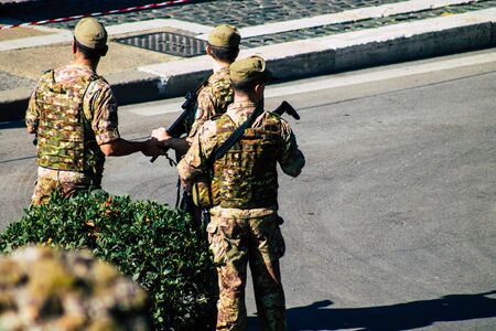 Rome Italy September 29, 2019 View of an Italian soldier on protection mission of the Coliseum of Rome in the morningの写真素材