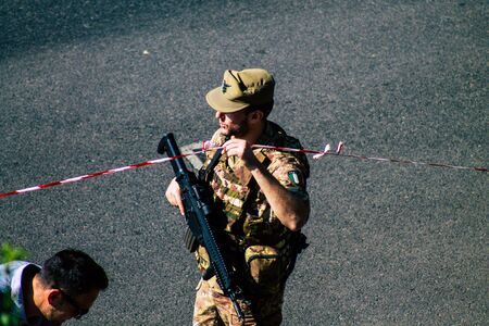 Rome Italy September 29, 2019 View of an Italian soldier on protection mission of the Coliseum of Rome in the morningの写真素材