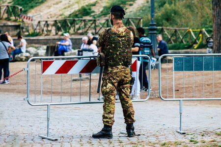 Rome Italy September 29, 2019 View of an Italian soldier on protection mission of the Coliseum of Rome in the morningの写真素材