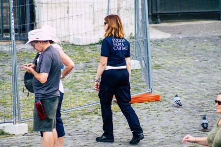 Rome Italy September 29, 2019 View of a Italian police officer on protection mission of the Coliseum of Rome in the morningの写真素材