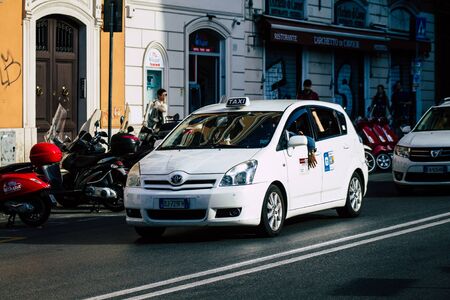 Rome Italy September 29, 2019 View of a traditional Italian taxi rolling through the streets of Rome in the morningの写真素材