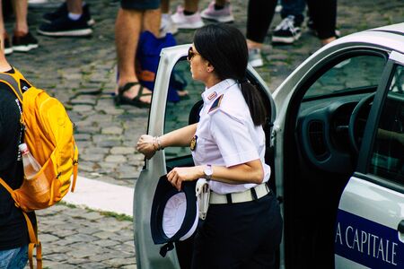Rome Italy September 29, 2019 View of a Italian police officer on protection mission of the Coliseum of Rome in the morningの写真素材
