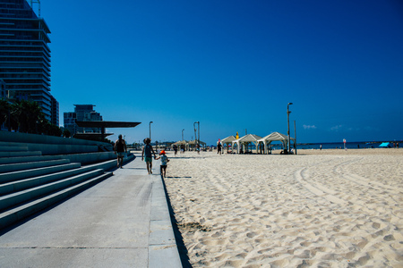 Tel Aviv Israel September 28, 2019 View of unknown Israeli people having fun on the beach of Tel Aviv during a sunny day in the afternoonのeditorial素材