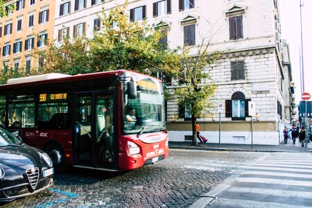 Rome Italy October 18, 2019 View of a public bus rolling through the streets of Rome in the eveningの写真素材