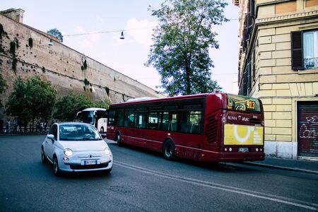 Rome Italy October 18, 2019 View of a public bus rolling through the streets of Rome in the eveningの写真素材