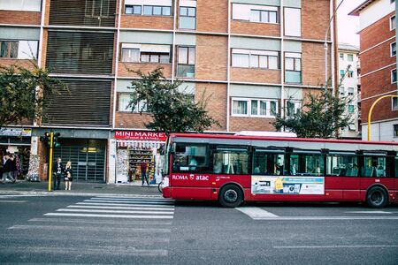 Rome Italy October 18, 2019 View of a public bus rolling through the streets of Rome in the eveningの写真素材
