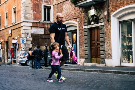 Rome Italy October 18, 2019 View of unknowns people walking in the streets of Rome near Vatican city in the afternoonの写真素材