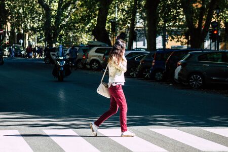 Rome Italy October 18, 2019 View of unknowns people walking in the streets of Rome near the Coliseum in the afternoonの写真素材