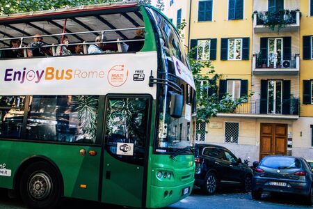 Rome Italy October 20, 2019 View of a tourist bus rolling through the streets of Rome in the eveningの写真素材