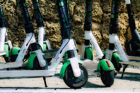 Tel Aviv Israel October 05, 2019 Closeup of electric scooters parked in the streets of Tel Aviv in the afternoonの写真素材