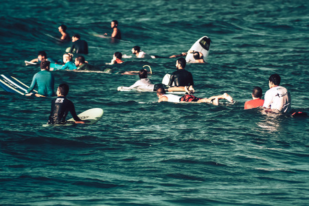 Tel Aviv Israel October 07, 2019 View of unknown Israeli people practicing surfing on Tel Aviv beach in the morningのeditorial素材
