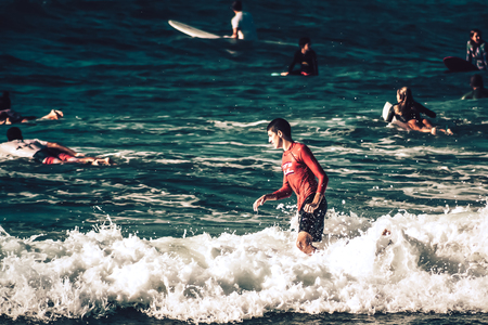 Tel Aviv Israel October 07, 2019 View of unknown Israeli people practicing surfing on Tel Aviv beach in the morningのeditorial素材
