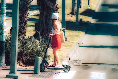 Tel Aviv Israel October 08, 2019 View of unknown Israeli people rolling with an electric scooter in the streets of Tel Aviv in the afternoonの写真素材