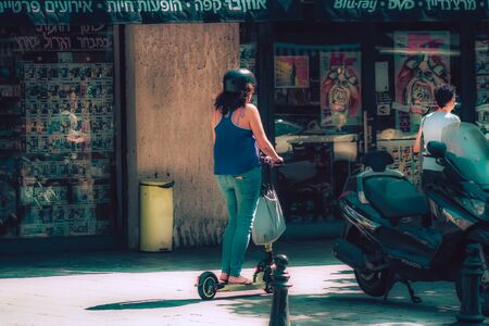 Tel Aviv Israel October 08, 2019 View of unknown Israeli people rolling with an electric scooter in...