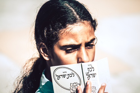Jerusalem Israel October 06, 2019 View of unknowns Israeli young girls praying front the Western wall in the Old city of Jerusalem in the afternoonのeditorial素材