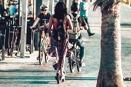 Tel Aviv Israel October 03, 2019 View of unknown Israeli people rolling with a electric scooter in...
