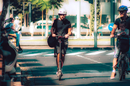 Tel Aviv Israel October 08, 2019 View of unknown Israeli people rolling with an electric scooter in the streets of Tel Aviv in the afternoonのeditorial素材