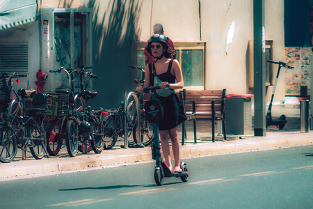 Tel Aviv Israel October 08, 2019 View of unknown Israeli people rolling with an electric scooter in the streets of Tel Aviv in the afternoonのeditorial素材