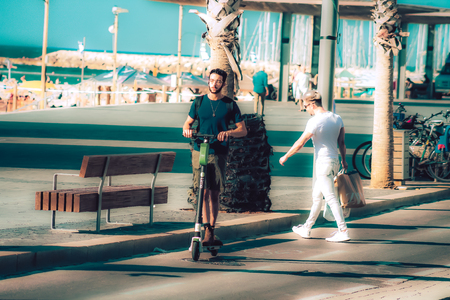 Tel Aviv Israel October 08, 2019 View of unknown Israeli people rolling with an electric scooter in the streets of Tel Aviv in the afternoonのeditorial素材