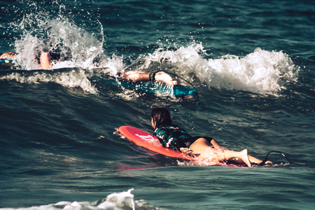 Tel Aviv Israel October 07, 2019 View of unknown Israeli people practicing surfing on Tel Aviv beach in the morningのeditorial素材