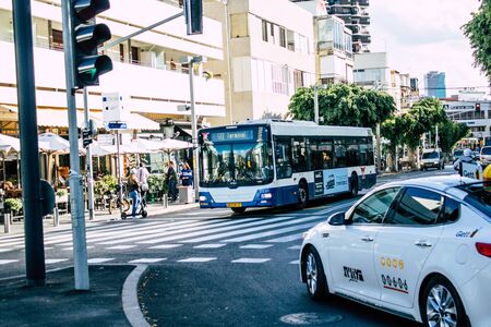 Tel Aviv Israel December 02, 2019 View of a traditional Israeli public city bus rolling in the streets of Tel Aviv in in the afternoonの写真素材