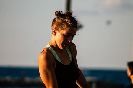 Tel Aviv Israel December 04, 2019 View of a girl dancing with a stick front the beach of Tel Aviv in the afternoonの写真素材