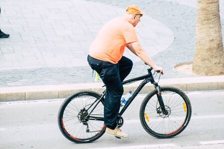 Tel Aviv Israel December 07, 2019 View of unknown people rolling with a bicycle in the streets of...