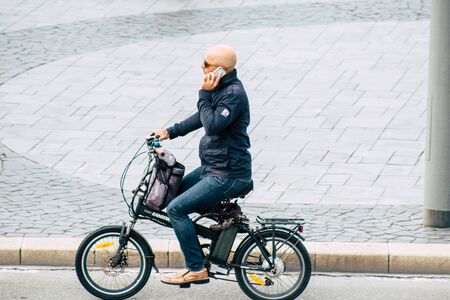 Tel Aviv Israel December 07, 2019 View of unknown people rolling with a bicycle in the streets of Tel Aviv in the afternoonの写真素材