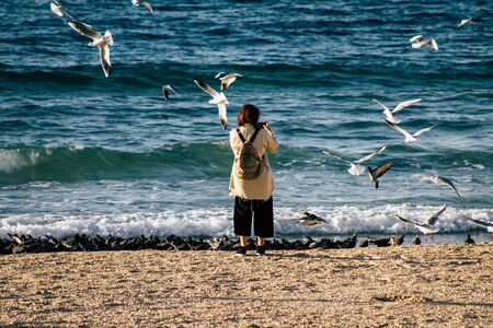 Tel Aviv Israel December 04, 2019 View of unknown people having fun on the beach of Tel Aviv in the afternoonの写真素材