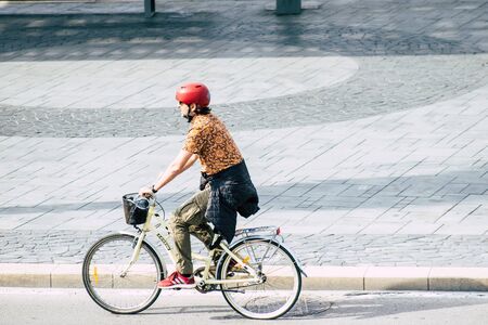 Tel Aviv Israel December 07, 2019 View of unknown people rolling with a bicycle in the streets of Tel Aviv in the afternoonの写真素材