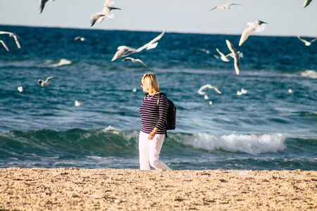 Tel Aviv Israel December 04, 2019 View of unknown people having fun on the beach of Tel Aviv in the afternoonの写真素材