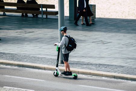 Tel Aviv Israel December 07, 2019 View of unknown Israeli people rolling with a electric scooter in...