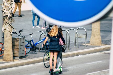 Tel Aviv Israel December 07, 2019 View of unknown Israeli people rolling with a electric scooter in...